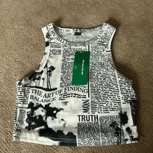 newspaper top, size xs, tag still on!